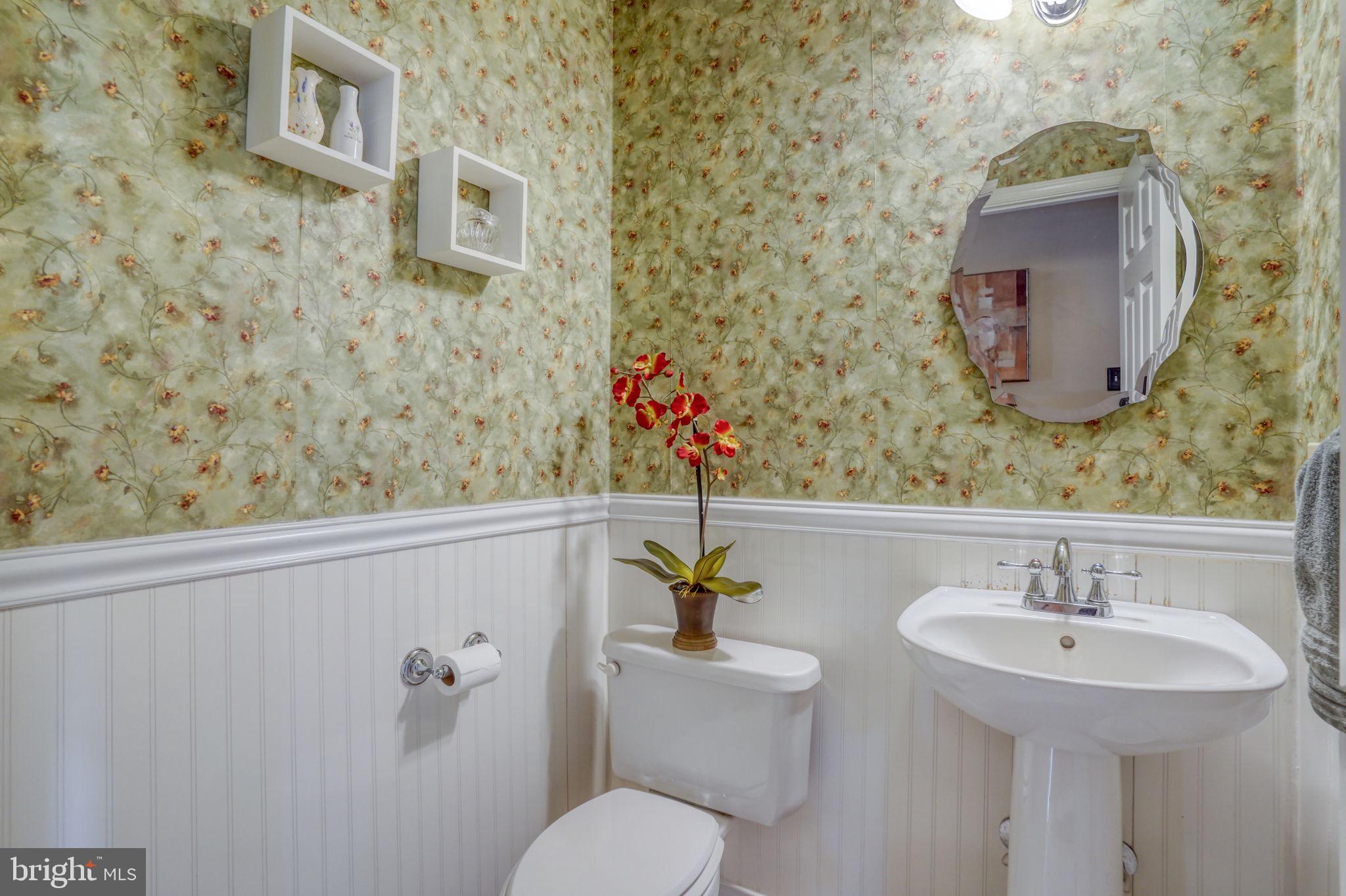 108 Burning Tree Road Dover, DE 19904 - Photo 39 of 70 a bathroom with a toilet sink and mirror