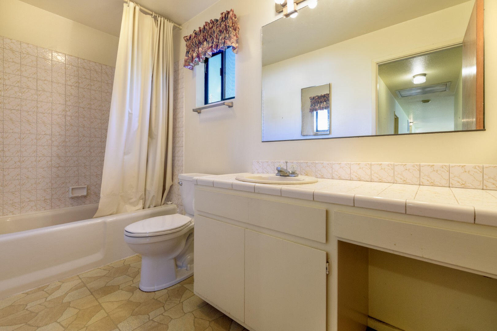 7035 Riverside Drive Redding, CA 96001 - Photo 12 of 23 a bathroom with a sink toilet and shower