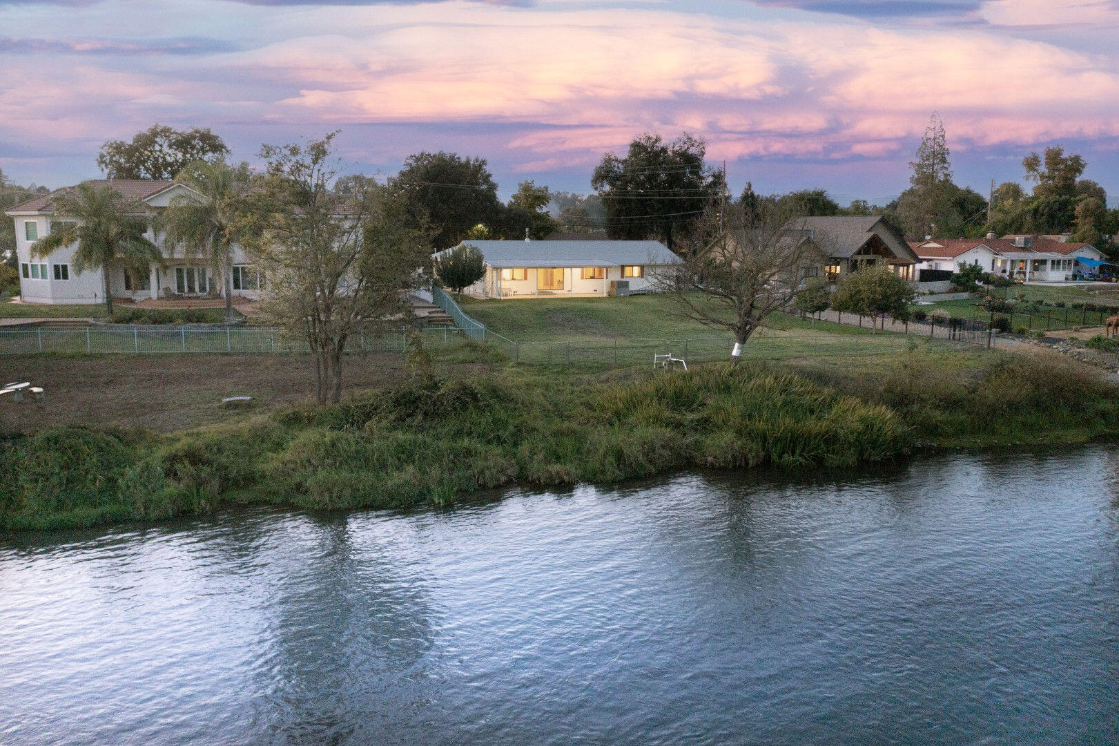 7035 Riverside Drive Redding, CA 96001 - Photo 3 of 23 a view of a lake with a mountain