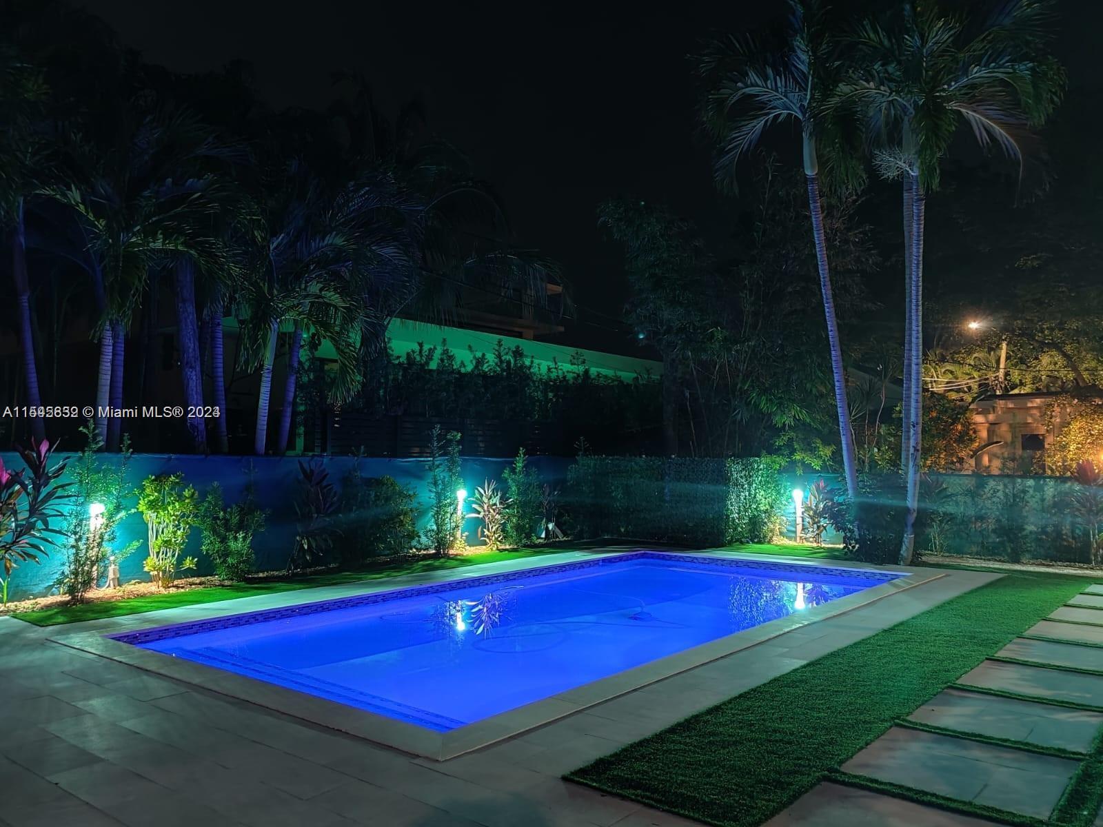 a view of outdoor space with swimming pool and patio