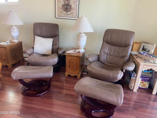 a living room with furniture and a chair