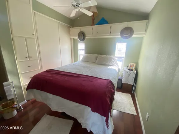 a bedroom with a bed and a mirror