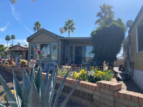 a view of a dining room with furniture chandelier and wooden floor