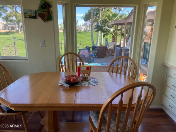 a view of a dining room with furniture window and outside view