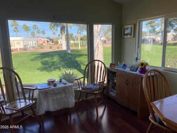 a view of a dining room with furniture window and wooden floor