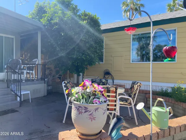 a view of a chairs and table in a patio