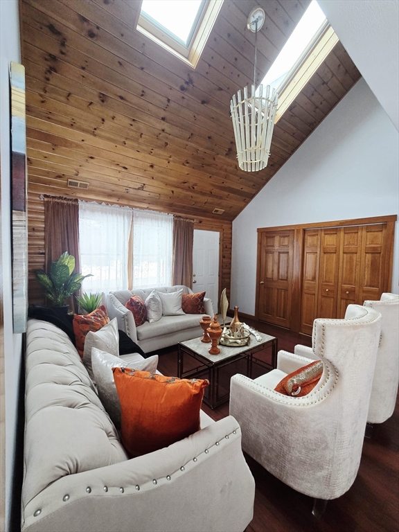 20 Farm Pond Road Dracut, MA 01826 - Photo 12 of 38 a living room with furniture and a wooden floor