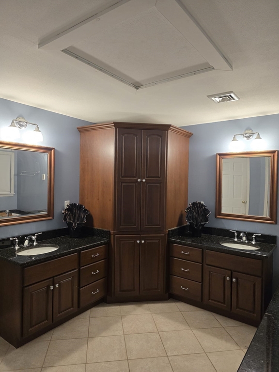 20 Farm Pond Road Dracut, MA 01826 - Photo 23 of 38 a kitchen with stainless steel appliances granite countertop a refrigerator and a stove