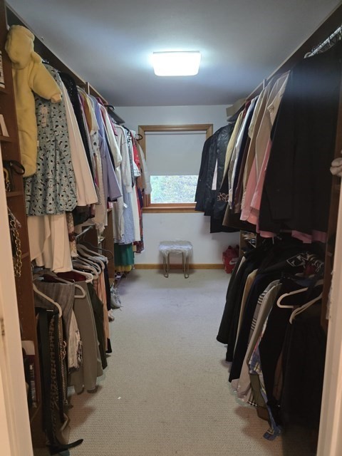 20 Farm Pond Road Dracut, MA 01826 - Photo 28 of 38 a view of walk in closet with clothes and shoes