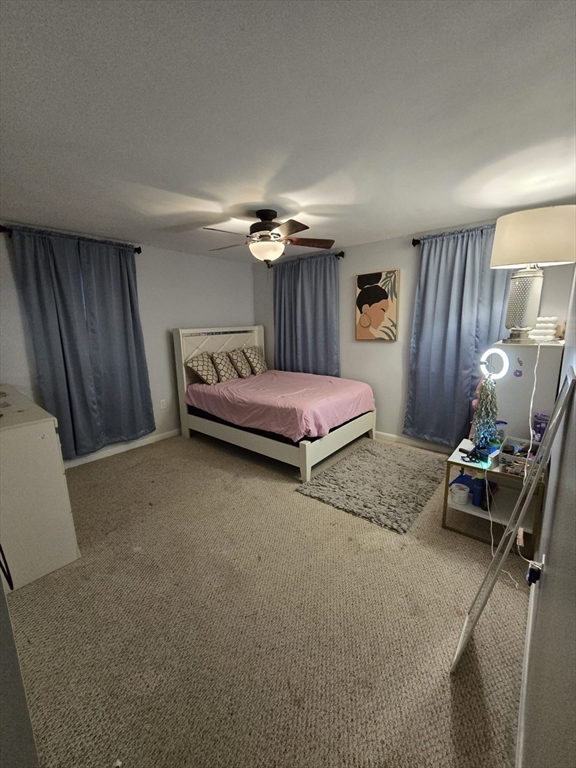 20 Farm Pond Road Dracut, MA 01826 - Photo 32 of 38 a bedroom with furniture and a bed