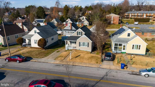 a view of multiple houses with a street