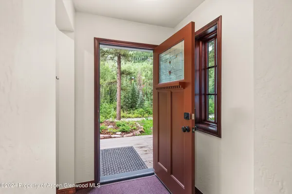 a view of an empty room with a window