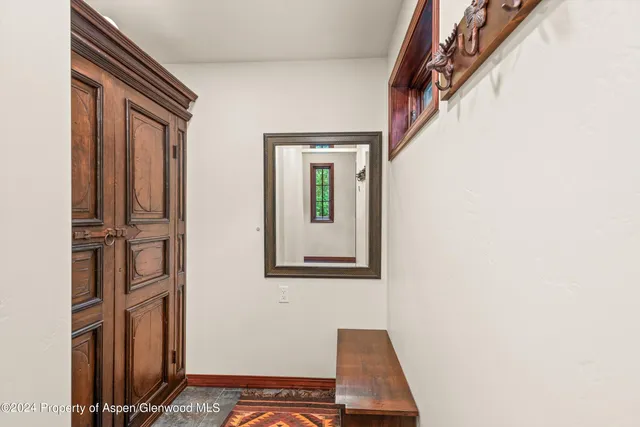 a bathroom with double vanity sinks and a shower