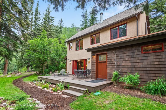 a view of an entryway with wooden floor and windows