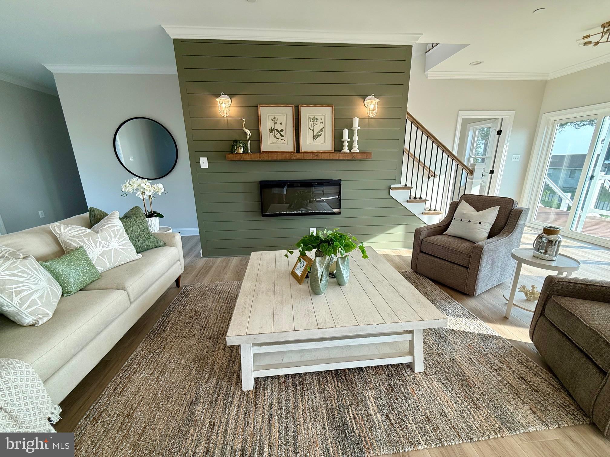 16394 Thomas Road Piney Point, MD 20674 - Photo 12 of 53 a living room with furniture and a fireplace