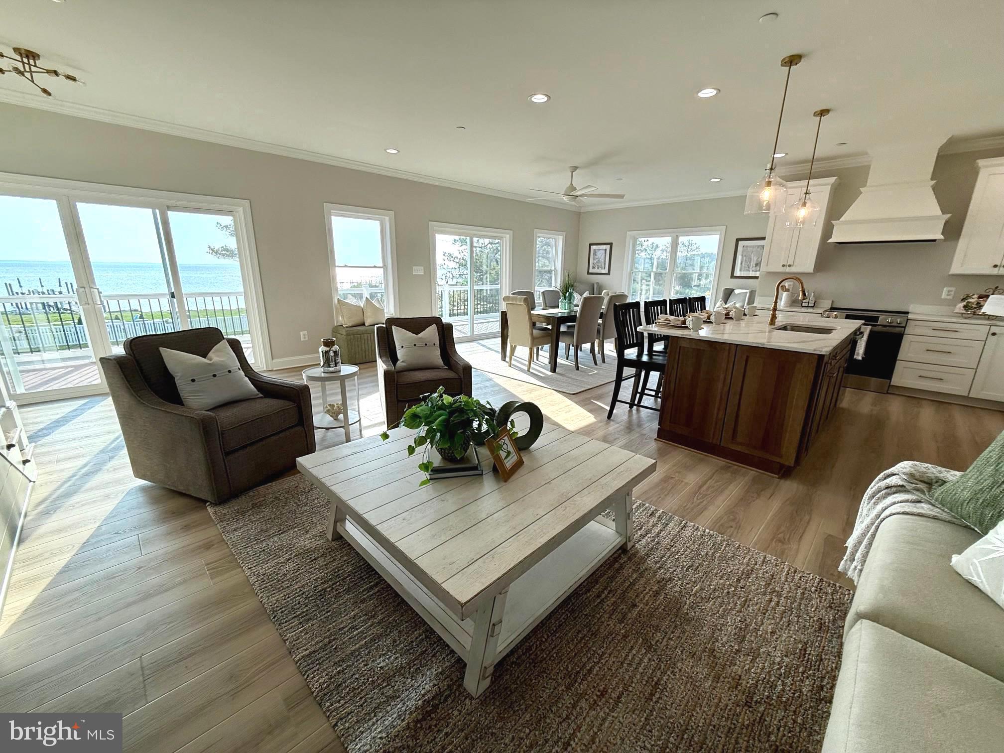16394 Thomas Road Piney Point, MD 20674 - Photo 13 of 53 a living room with furniture and a large window