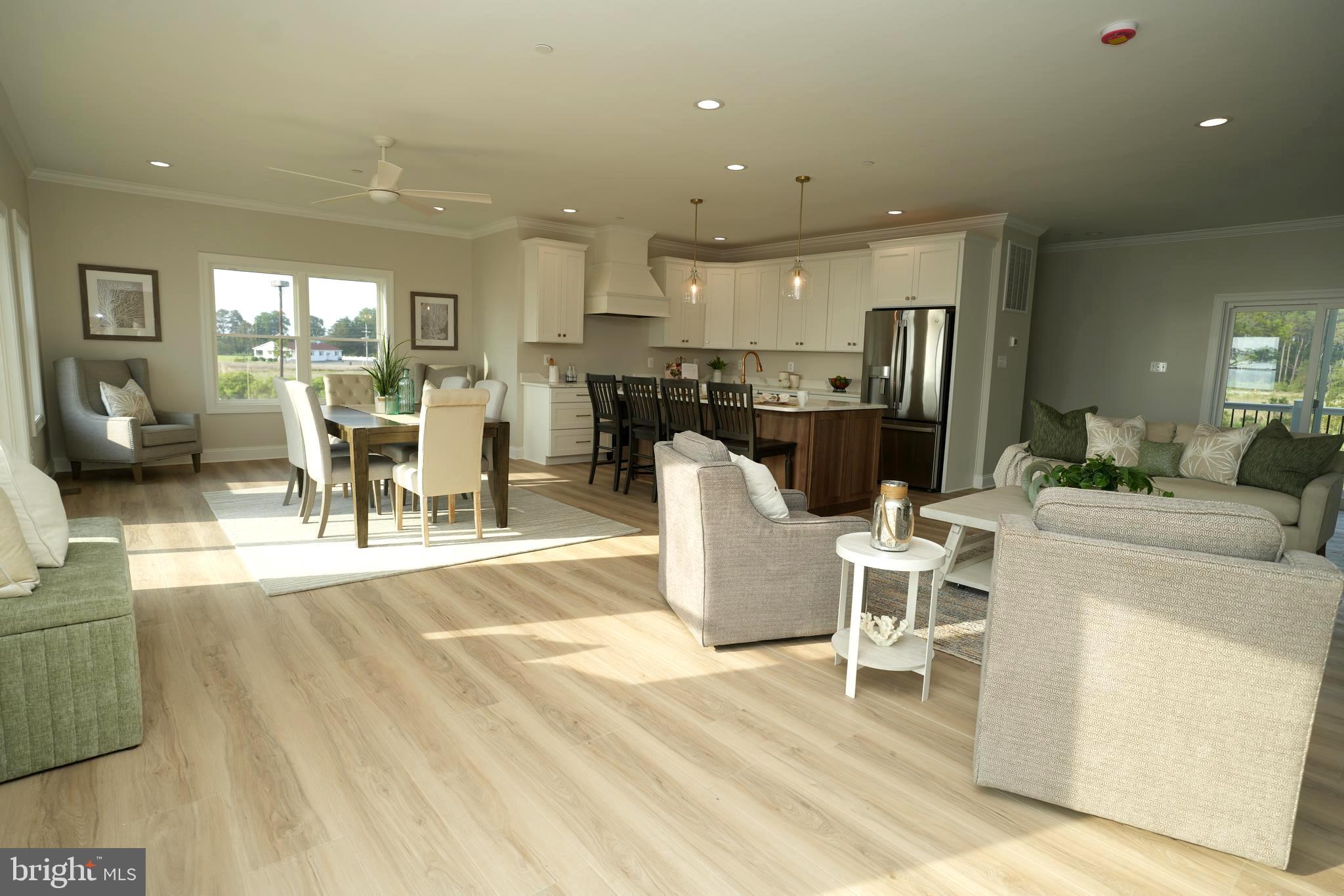 16394 Thomas Road Piney Point, MD 20674 - Photo 14 of 53 a dining room with furniture and a view of kitchen