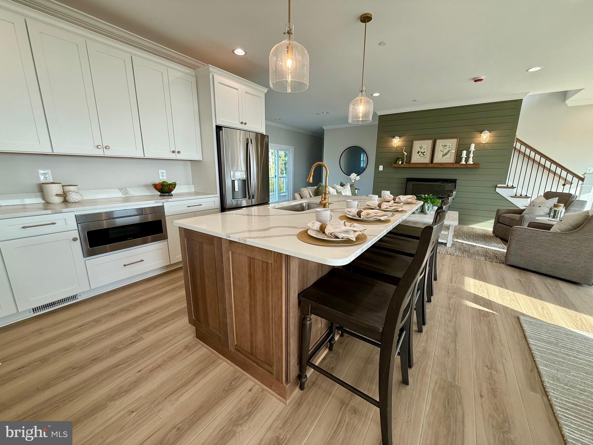16394 Thomas Road Piney Point, MD 20674 - Photo 16 of 53 a large kitchen with a table and chairs