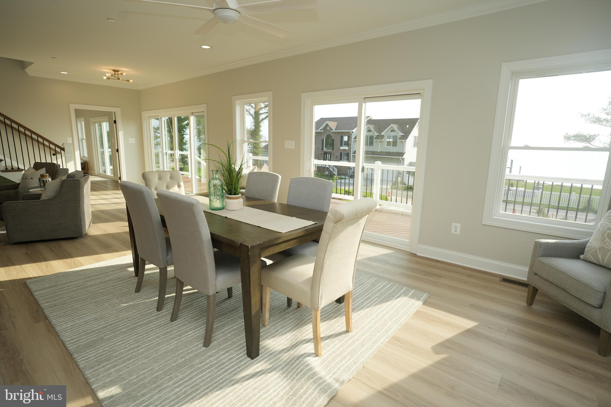 16394 Thomas Road Piney Point, MD 20674 - Photo 21 of 53 a view of a dining room with furniture window and wooden floor