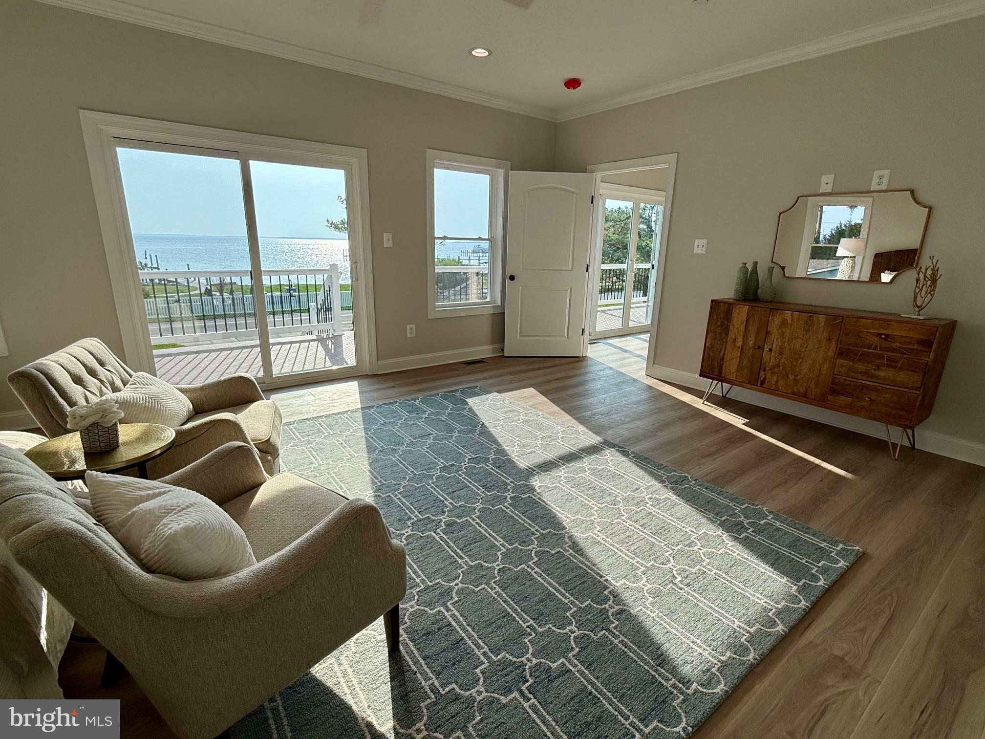 16394 Thomas Road Piney Point, MD 20674 - Photo 27 of 53 a living room with furniture and a rug