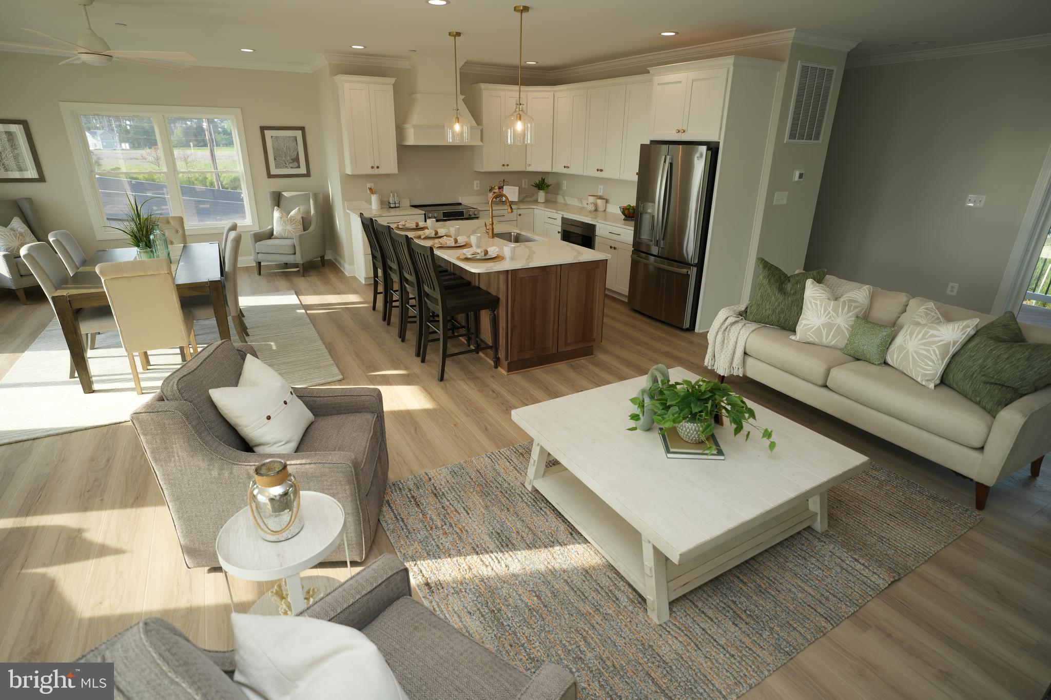 16394 Thomas Road Piney Point, MD 20674 - Photo 9 of 53 a living room with stainless steel appliances kitchen island granite countertop furniture and rug