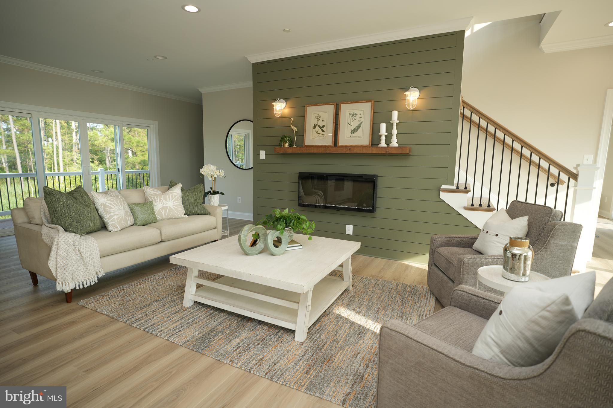 16394 Thomas Road Piney Point, MD 20674 - Photo 10 of 53 a living room with furniture and a fireplace