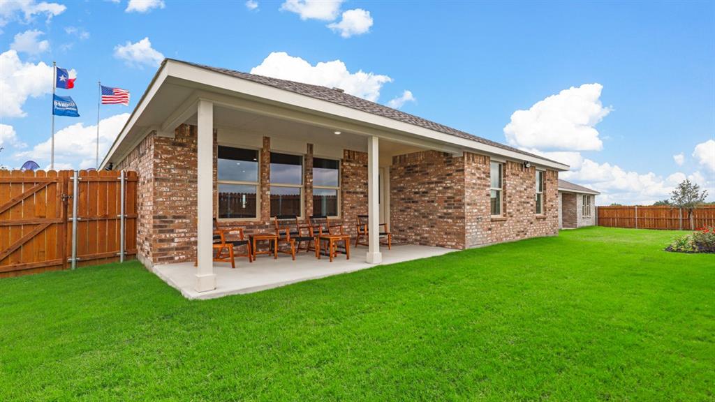 1252 Hollyn Drive Decatur, TX 76234 - Photo 39 of 40 Rear Elevation - All Home and community information, including pricing, included features, terms, availability and amenities, are subject to change at any time without notice or obligation. All Drawings, pictures, photographs, video, square footages, floor plans, elevations, features, colors and sizes are approximate for illustration purposes only and will vary from the homes as built.