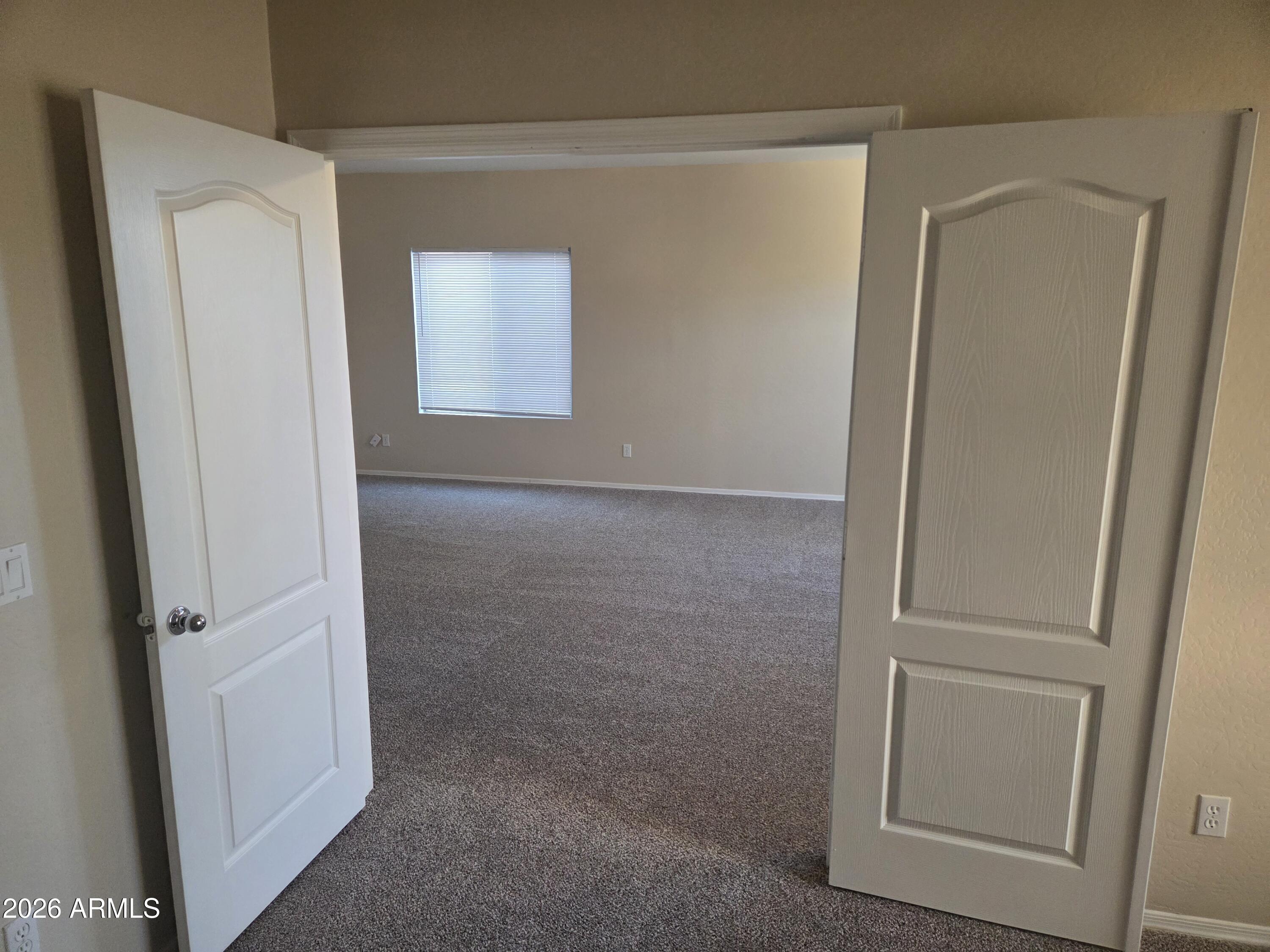 14195 West Hearn Road Surprise, AZ 85379 - Photo 9 of 23 an empty room with windows