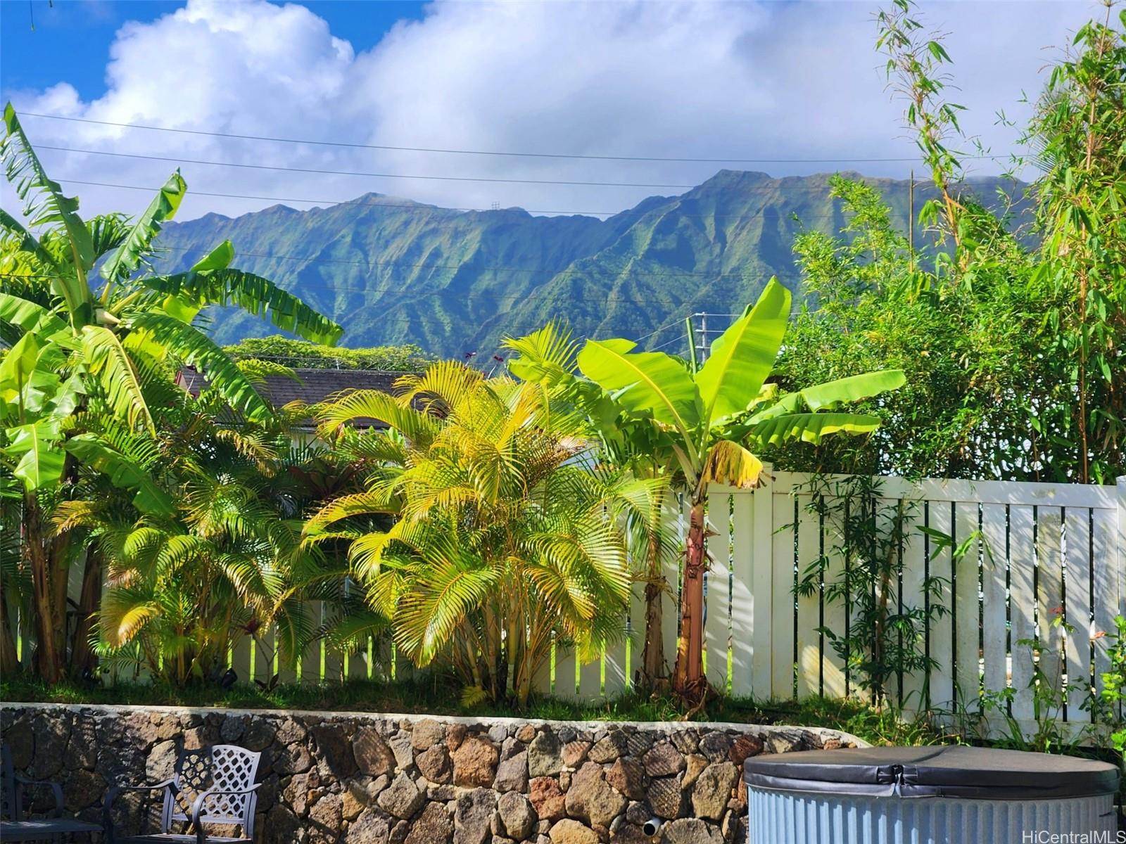 47-285 Waihee Road, Unit D Kaneohe, HI 96744 - Photo 19 of 25 a view of a garden with a flower in a garden