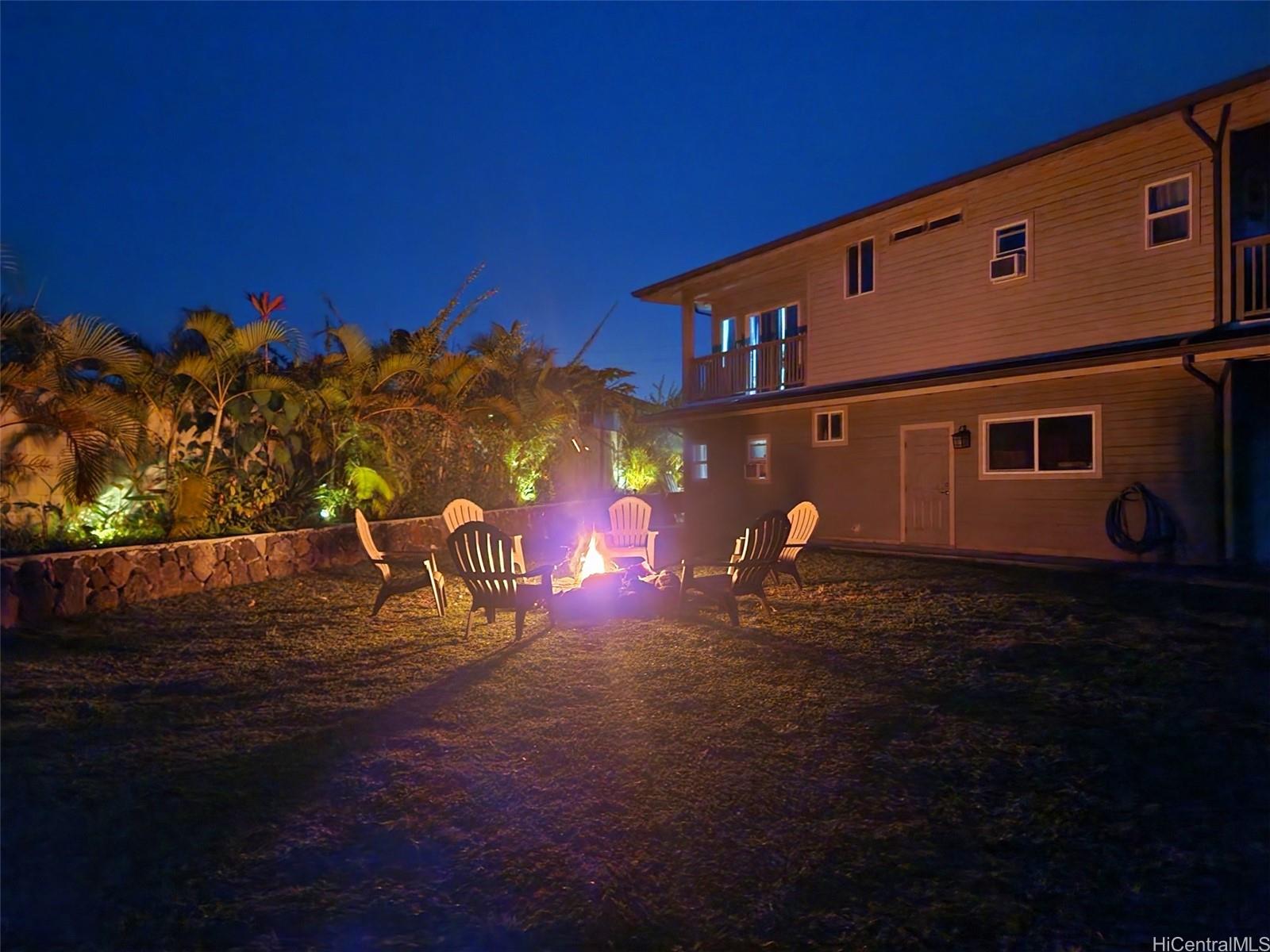 47-285 Waihee Road, Unit D Kaneohe, HI 96744 - Photo 22 of 25 a view of a street with sunset view