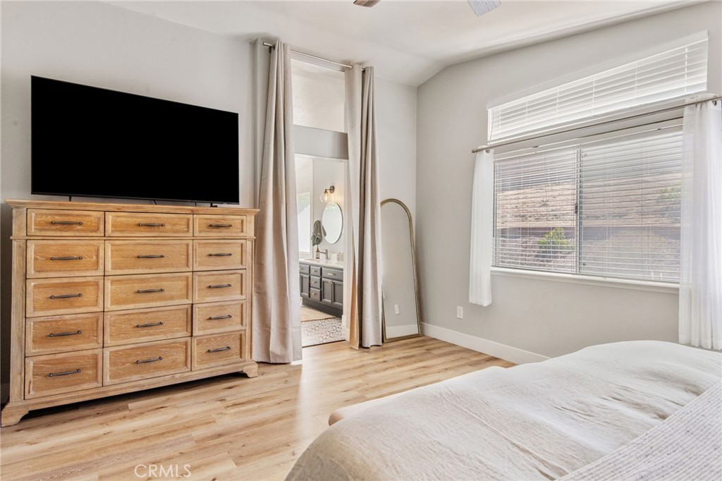 40456 Windsor Road Temecula, CA 92591 - Photo 18 of 38 a bedroom with a bed and a flat screen tv