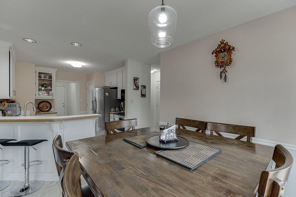 1262 Bowman Road Lawrenceville, GA 30045 - Photo 11 of 32 a kitchen with a table and appliances