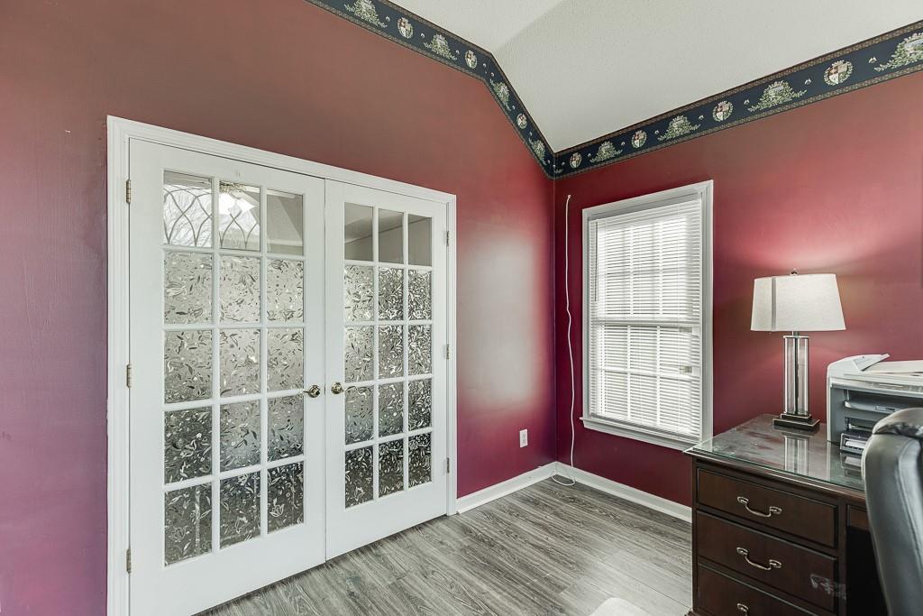 1262 Bowman Road Lawrenceville, GA 30045 - Photo 23 of 32 a view of workspace with a window and dresser