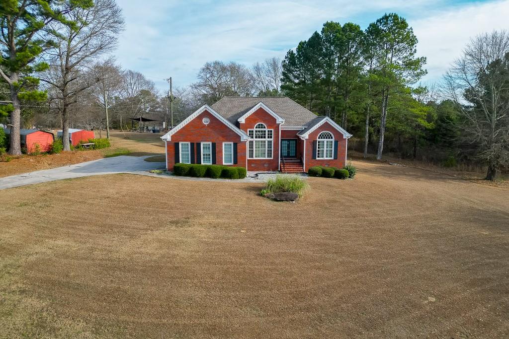 1262 Bowman Road Lawrenceville, GA 30045 - Photo 29 of 32 a view of a house with a yard