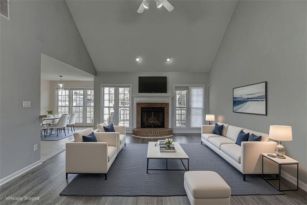 1262 Bowman Road Lawrenceville, GA 30045 - Photo 5 of 32 a living room with furniture and a fireplace