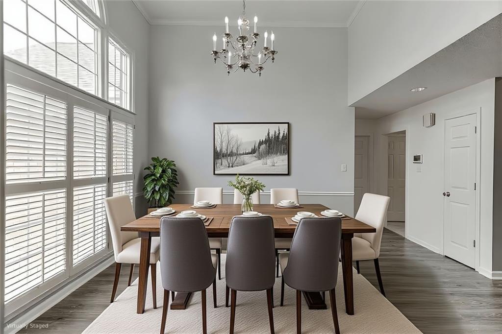 1262 Bowman Road Lawrenceville, GA 30045 - Photo 6 of 32 a view of a dining room with furniture window and wooden floor