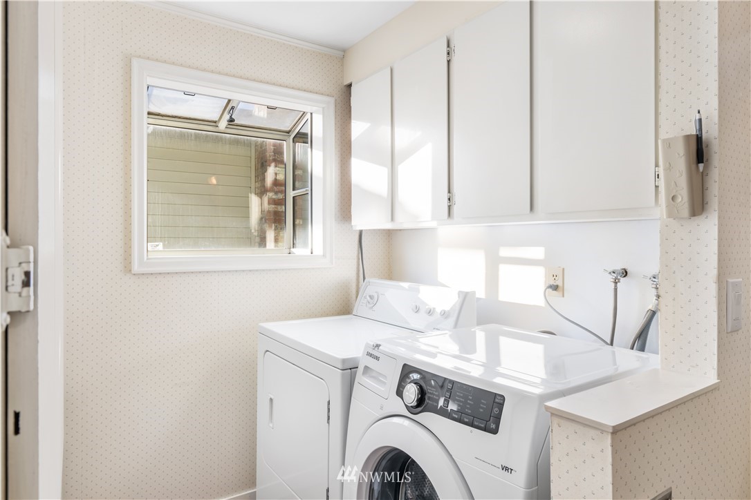 2012 Jones Circle Southeast Renton, WA 98055 - Photo 16 of 25 a view of washer and dryer with bathroom in the background