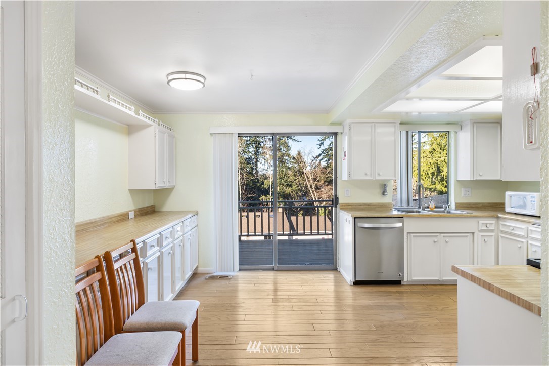 2012 Jones Circle Southeast Renton, WA 98055 - Photo 5 of 25 a large white kitchen with a window