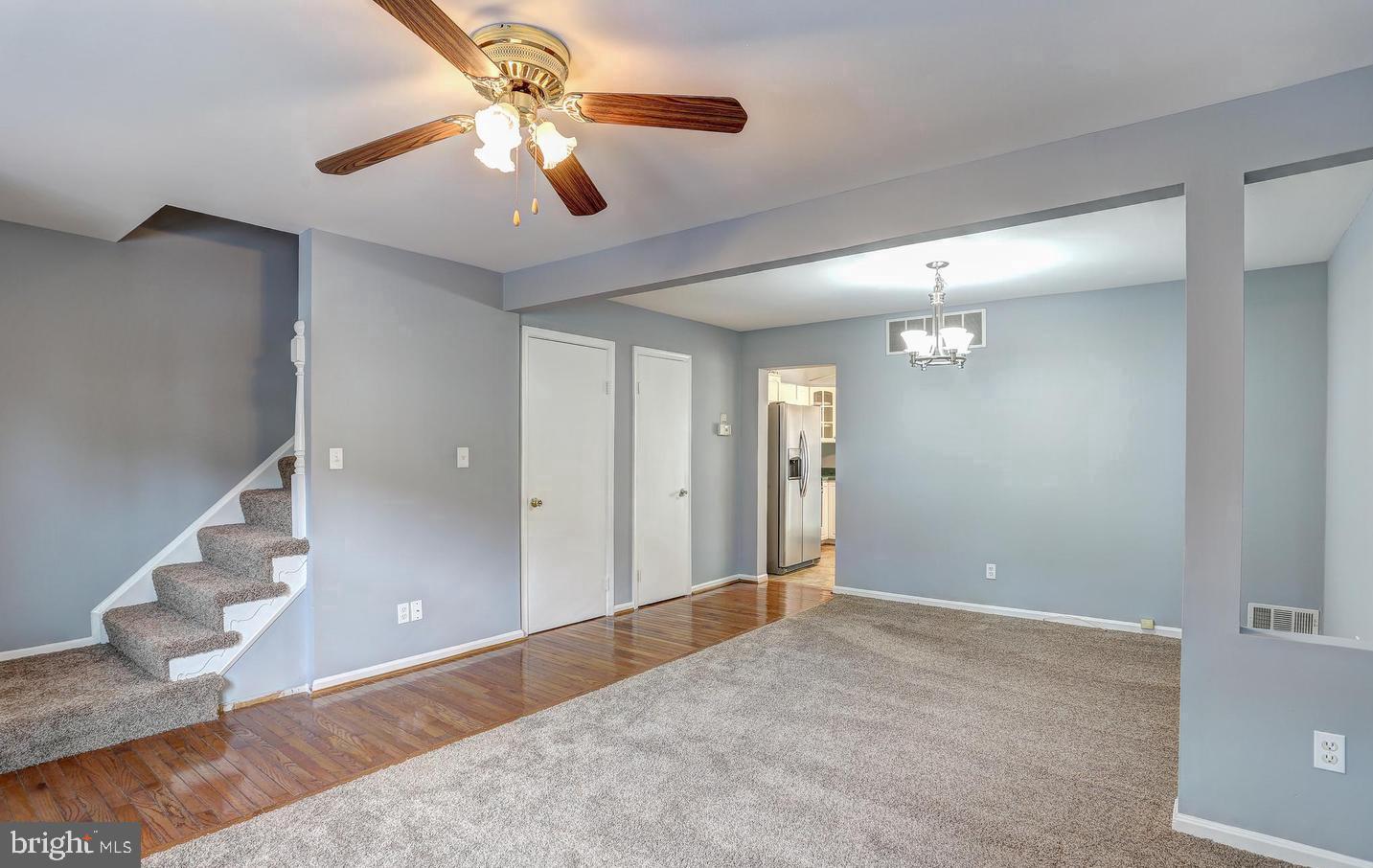 5 Cardor Court, Unit 5 Nottingham, MD 21236 - Photo 2 of 11 a view of a livingroom with a chandelier fan and wooden floor