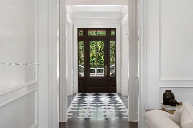 a kitchen with a stove a sink and a window