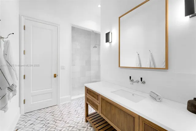 a spacious bedroom with a bed and a couch