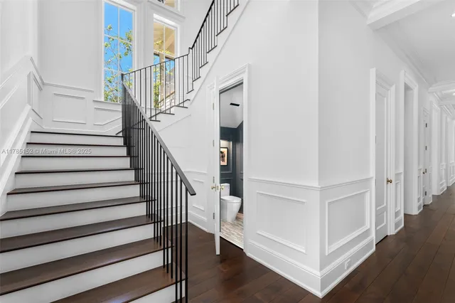 a view of a balcony with two chairs and a table