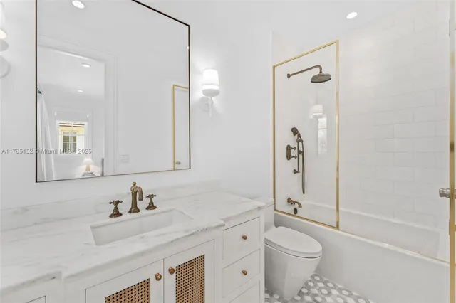 a view of a patio with a table chairs and a potted plant