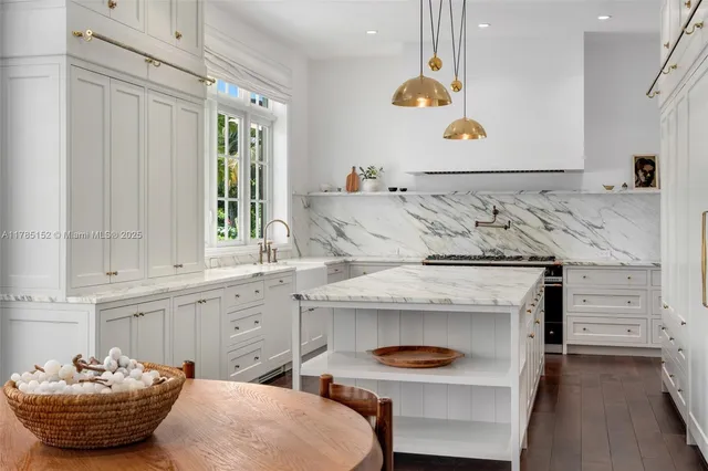 a spacious bedroom with a bed a couch and a flat screen tv