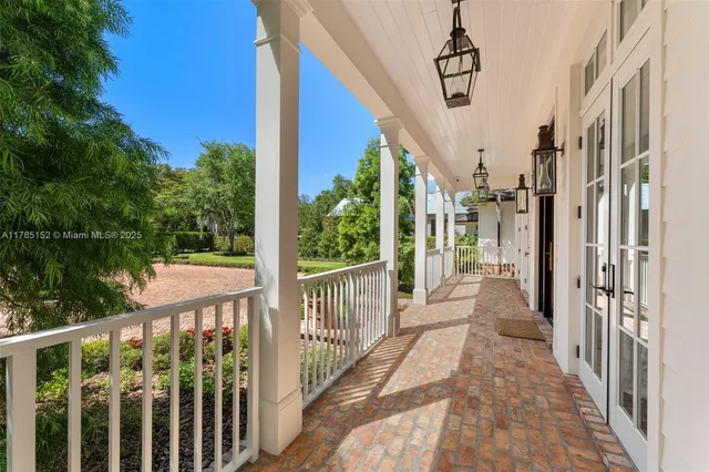a hallway with white and black white checkered floor