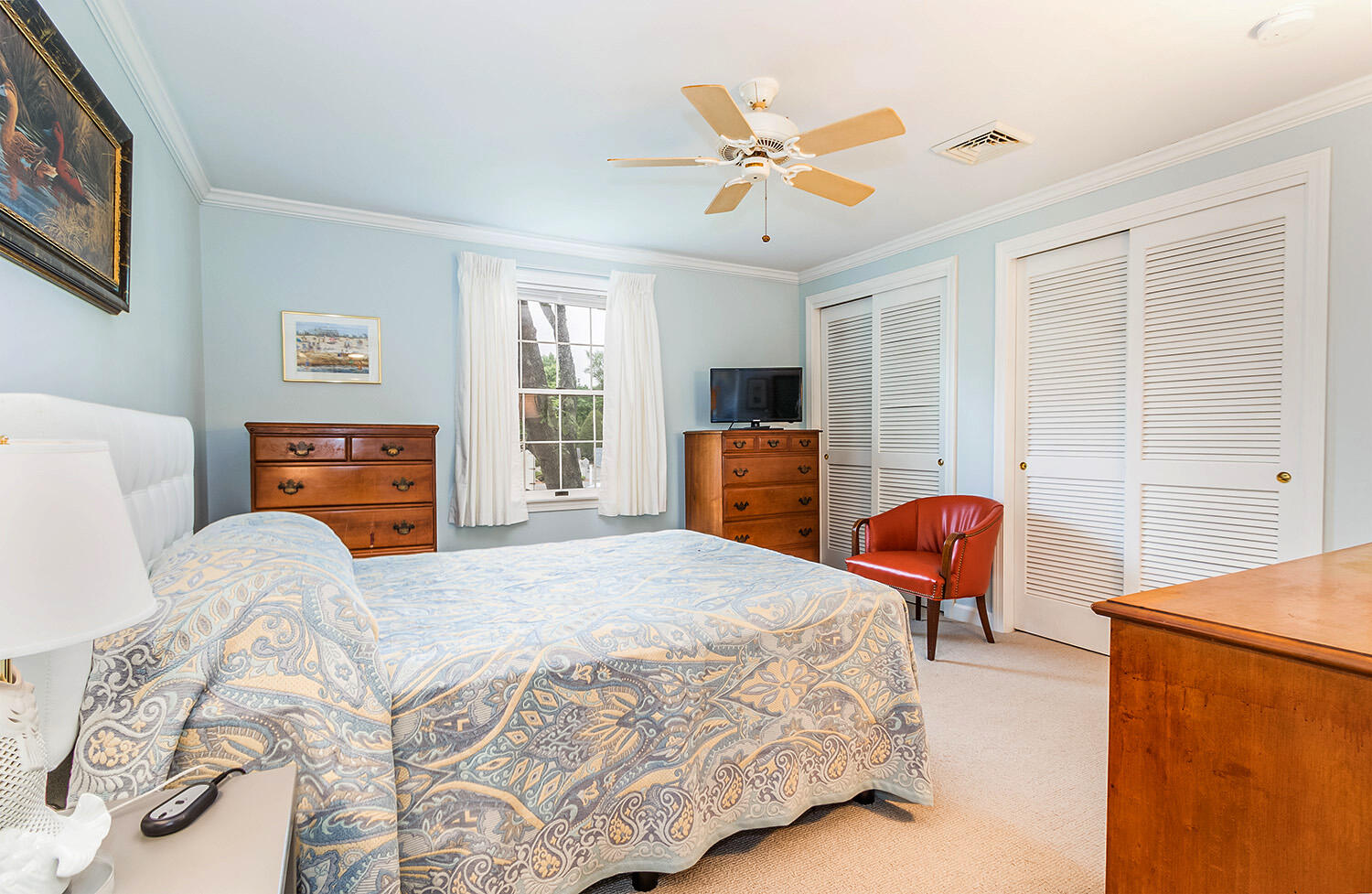 39 Tower Hill Road, Unit 4C Osterville, MA 02655 - Photo 14 of 23 a bedroom with a bed dresser and wooden floor