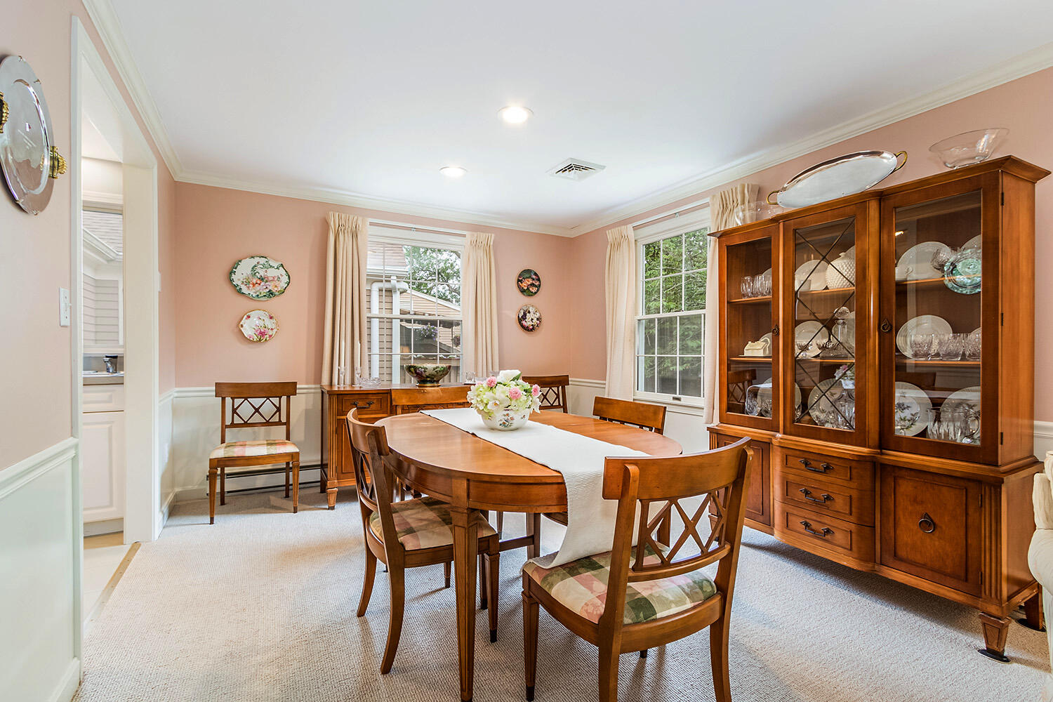 39 Tower Hill Road, Unit 4C Osterville, MA 02655 - Photo 7 of 23 a dining room with a wooden table and chairs