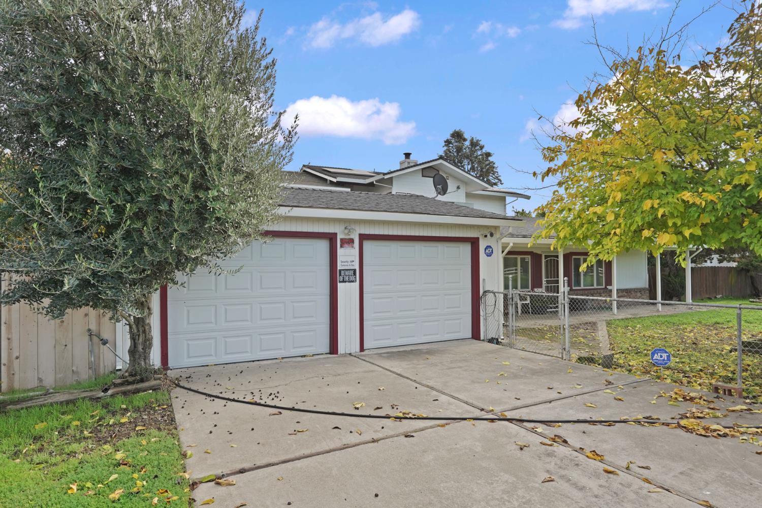 5766 Alpine Road Stockton, CA 95215 - Photo 26 of 99 front view of a house with a garden