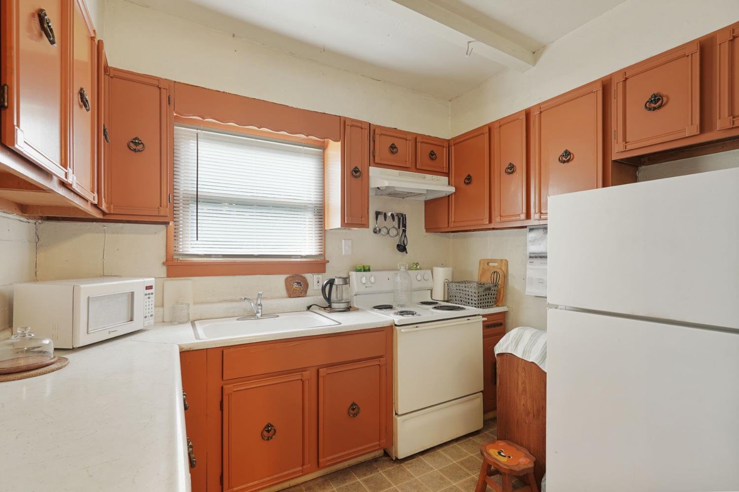 5766 Alpine Road Stockton, CA 95215 - Photo 33 of 99 a kitchen with a sink a stove a refrigerator and a sink