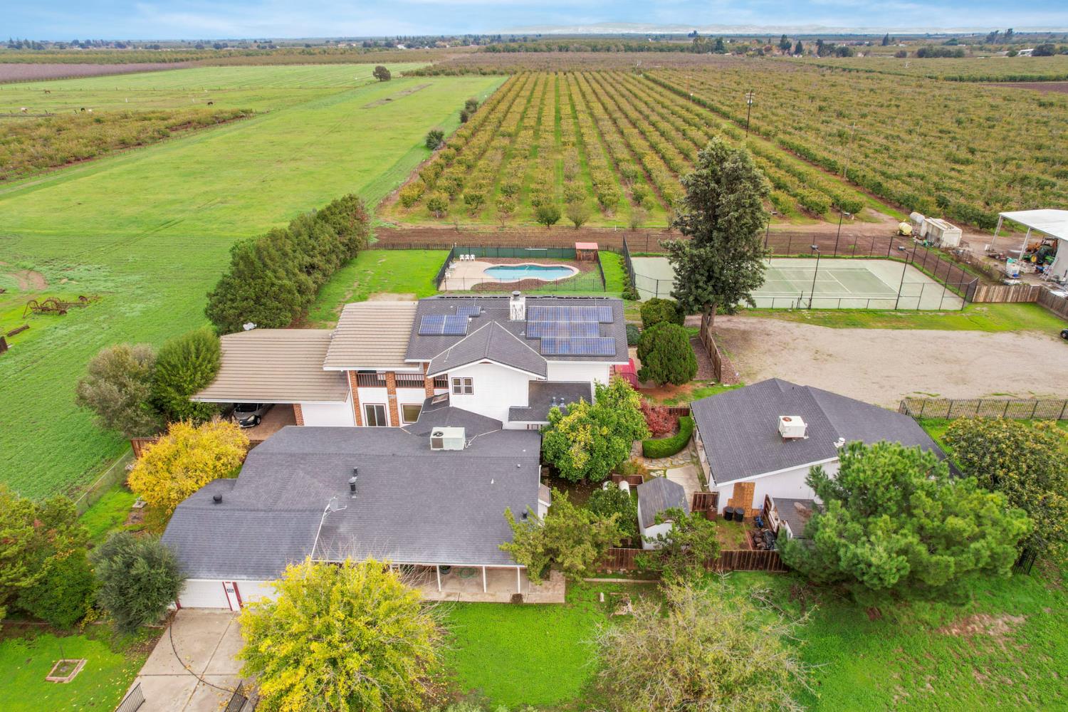 5766 Alpine Road Stockton, CA 95215 - Photo 4 of 99 an aerial view of residential houses with outdoor space and a lake view